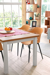 Dining table in interior of modern room