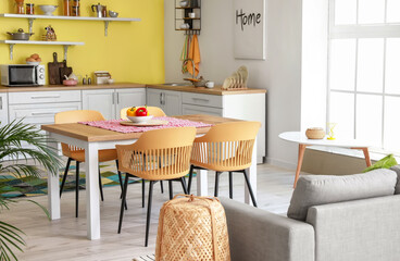 Interior of stylish modern kitchen with dining table