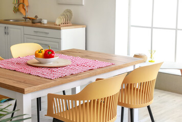 Dining table in interior of modern kitchen