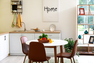 Dining table in interior of modern kitchen