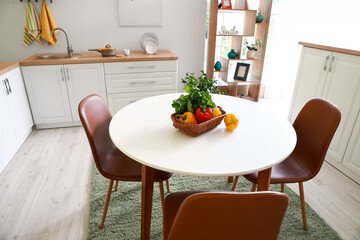 Dining table in interior of modern kitchen