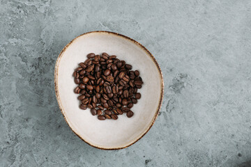 Fresh Coffee Beans on grey concrete background