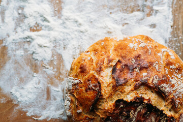 freshly baked bread on wooden background with copy space