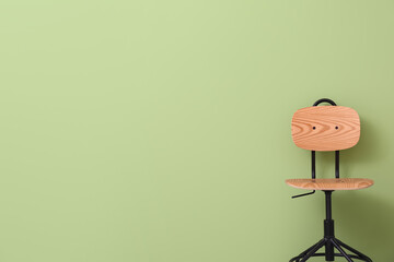 Modern swivel chair near color wall