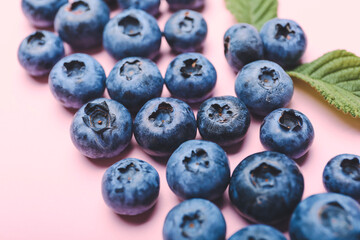 Tasty blueberry on color background