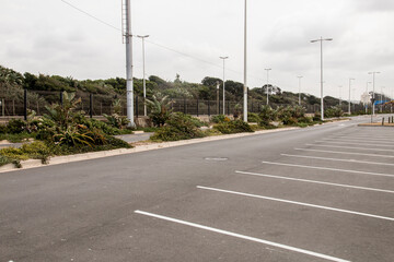 Roadway Surrounded by Green Vegettion with Marked Parking Bays