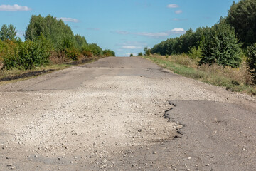 Broken asphalt road
