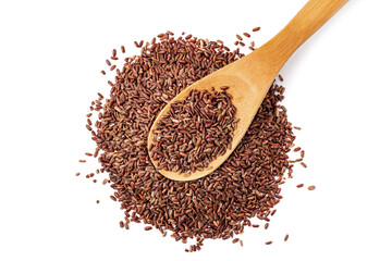 Filled wooden spoon with uncooked wild brown rice on heap cereal, isolated on white background. Red grains, organic natural healthy food top view. Ingredient for traditional Asian cuisine.