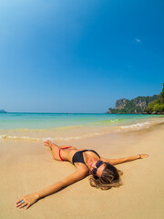 Woman on the Thai beach of Railay in Krabi