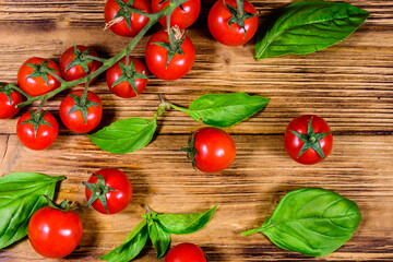 Heap of small cherry tomatoes on wooden table. Top view