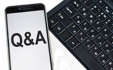 Q and A text in the phone lying on the laptop keyboard