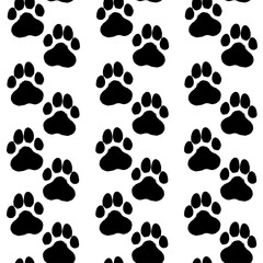 Fototapeta na wymiar Ink hand drawn seamless pattern with dog paws traces
