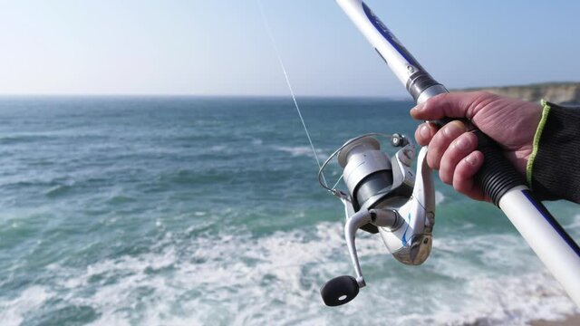 fisherman fishing rod and reel slow motion 4k