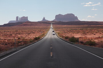 View of long road leading towards Monument Valley seen from Forrest Gump Point in Utah, USA