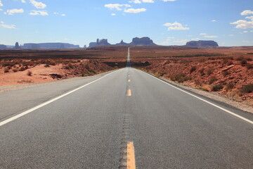 View of long road leading towards Monument Valley seen from Forrest Gump Point in Utah, USA