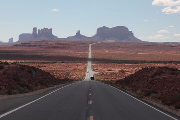 View of long road leading towards Monument Valley seen from Forrest Gump Point in Utah, USA