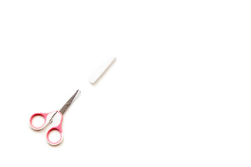 pink nail clippers with a white cap for cutting children's nails on a white background, children's manicure