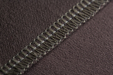 details of clothing, the seam is made on a sewing machine, the sections are processed with threads