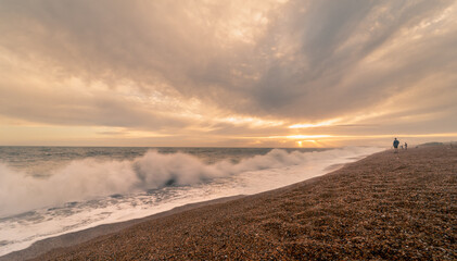 Sunset beach landscape photo with the crashing waves on Chisel Beach on the English south coast.  This is also known as the Jurassic Coastline.