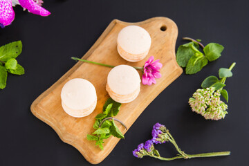Macarons and mint for dessert - healthy organic summer dessert. Creative atmospheric decoration.