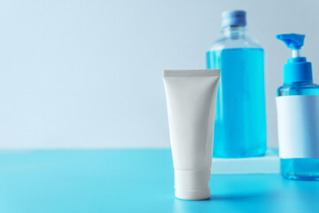 Collection of chemical blue Isopropyl alcohol (Ethanol or ethyl alcohol) liquid in a bottle for medical and prevent from germs, bacterial,coronavirus COVID-19 with blue and grey isolated background.