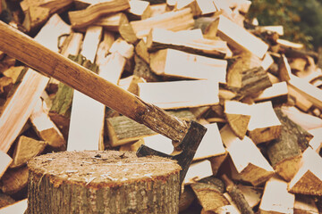 Wooden natural sawn logs with an ax.