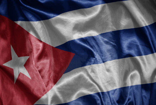 colorful shining big national flag of cuba on a silky texture.