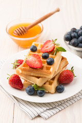 Belgian waffles for breakfast. Dessert food concept. 