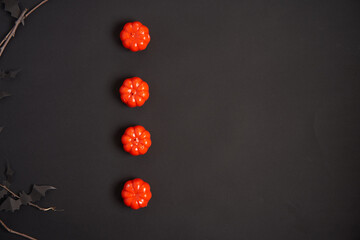 Halloween background, orange decorative plastic pumpkin black paper bat cardboard Thanksgiving greeting card