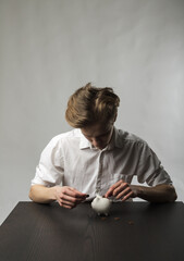 Young man and piggy bank.