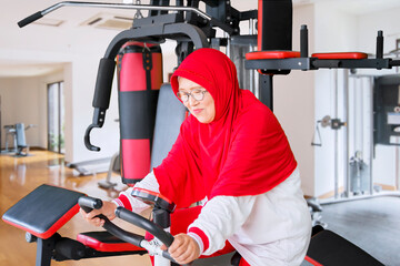 Muslim senior woman doing workout