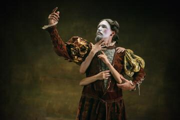 Fall in love. Young man as Johann Bach isolated on dark green background. Retro style, comparison of eras concept. Beautiful male model like historical character, great music composer, old-fashioned.