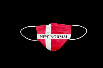 New normal text on face mask with flag of Denmark