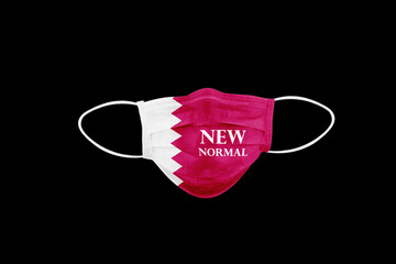 New normal text on medical mask with flag of Qatar