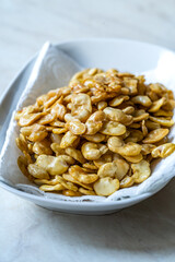 Homemade Fried Salty Roasted Fava Broad Beans Chips. Healthy Organic Snacks. Portuguese Style with Garlic.