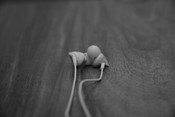 White wired earphone with motion blur background