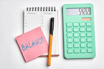 calculater ,pen and blank notebook for office on white background isolated. balance sign