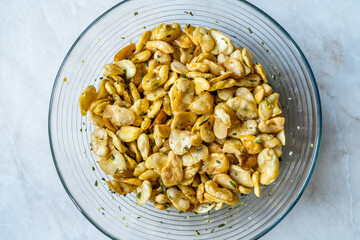 Homemade Fried Salty Roasted Fava Broad Beans Chips. Healthy Organic Snacks. Portuguese Style with Garlic.