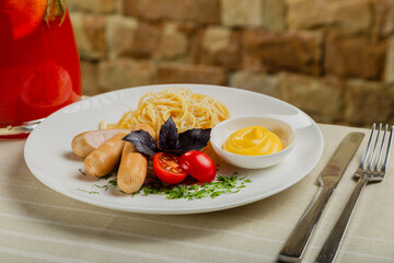 Fresh sausages with pasta and cheese sauce.