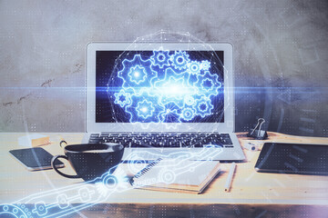 Double exposure of desktop computer and technology theme hologram. Concept of software development.