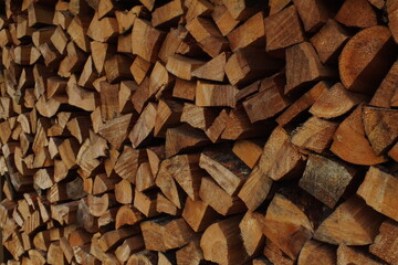 background macro image of round logs of brown color for a fireplace