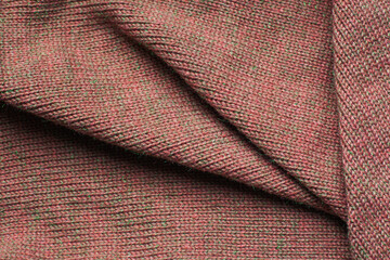 Pleats on fabric, knitted material of brown color, folds