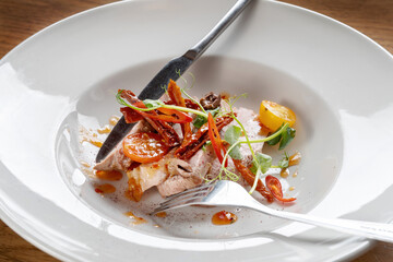 Roasted Duck Meat with Tomatoes, Small Green Sprouts and Sauce.