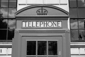 Fototapeta na wymiar Telephone booth in London UK - black and white vintage style