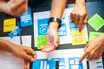 Close-up view Web designers use their creativity to design applications.