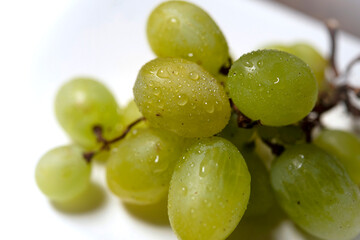 Fresh green grapes isolated on white background.