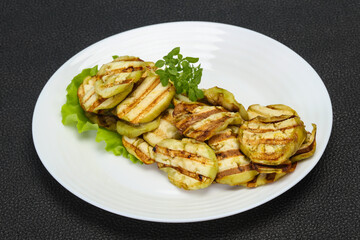 Grilled eggplant slices served basil