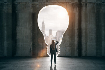 Businesswoman in black interior with lamp window and city view