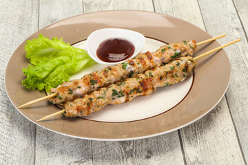 Minced pork skewer kebab with sauce