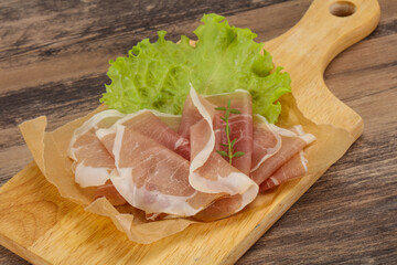 Italian prosciutto pork meat over board